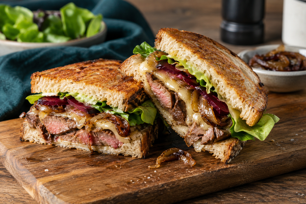 Steak sandwich made with thinly sliced leftover steak, beetroot and caramelised onion